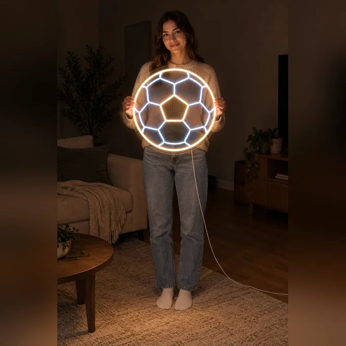 Football Neon LED Sign held by a woman, showing its size compared to her body