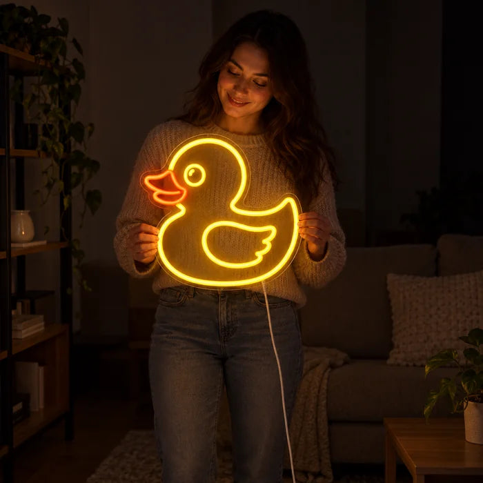 Yellow Duck Neon LED Sign held by a woman, showing its size compared to her body