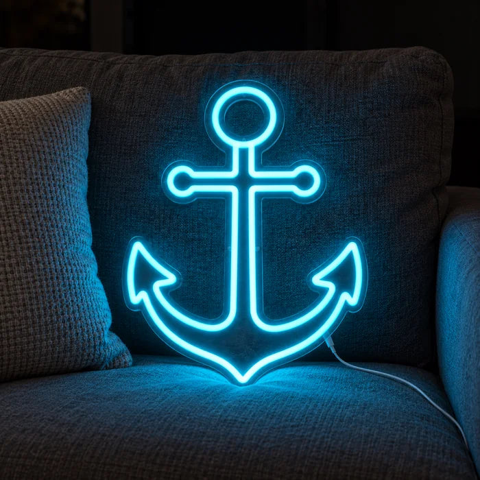 Harbour Anchor Neon LED Sign on a cosy sofa between cushions and a throw