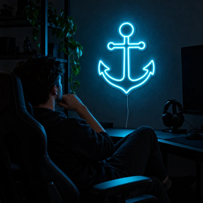 Harbour Anchor Neon LED Sign above a gaming desk, a gamer in a gaming chair in front of it