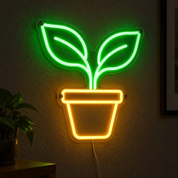 Little Sprout Neon LED Sign glowing on a dark wall, close-up with connection cable