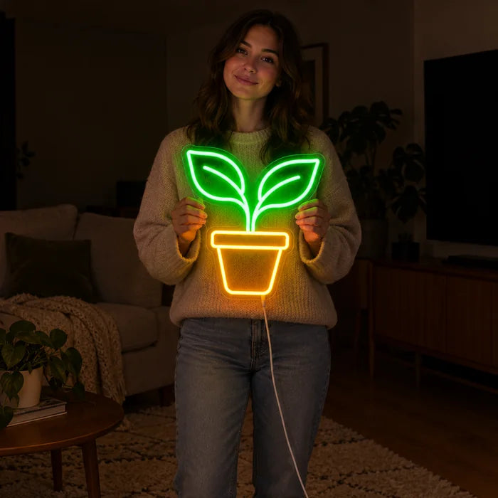 Little Sprout Neon LED Sign held by a woman, showing its size compared to her body