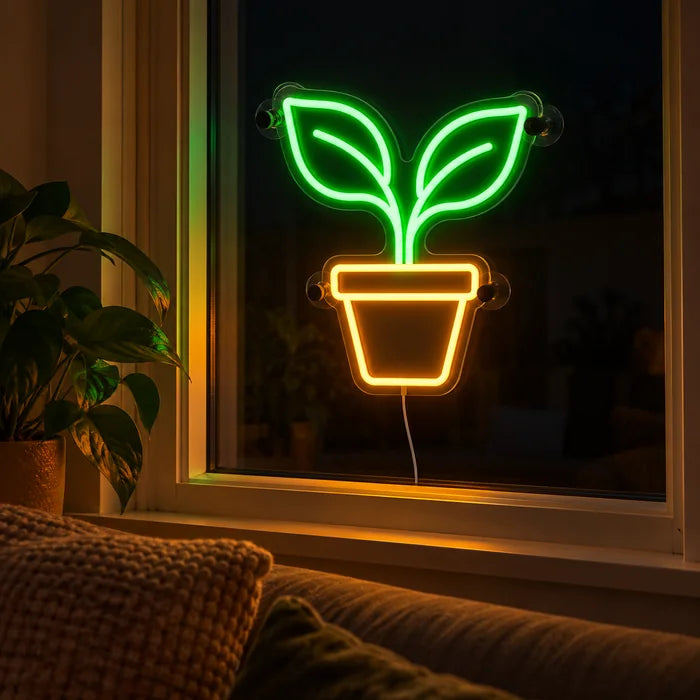 Little Sprout Neon LED Sign in the window of a cosy living room in the evening