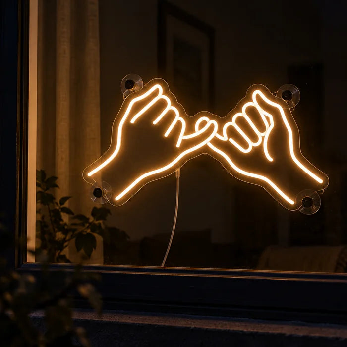 Pinky Promise Neon LED Sign in a window, seen from the street at night