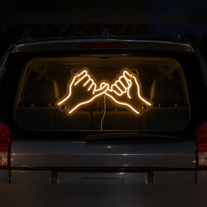 Pinky Promise Neon LED Sign on the rear window of a car at night