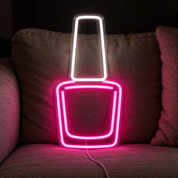 Nail Polish Neon LED Sign on a cosy sofa between cushions and a throw