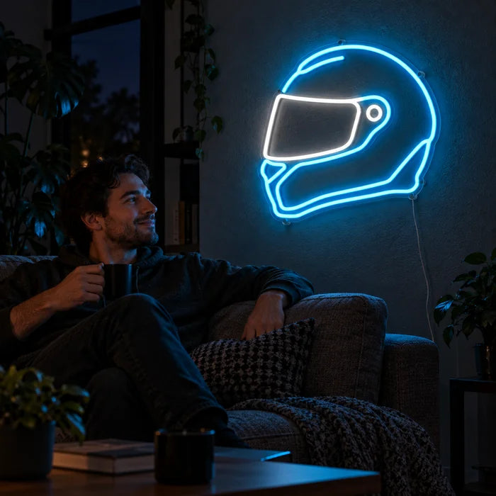 Neon Racing Helmet Neon LED Sign on a living room wall, a person relaxing on the sofa in front of it