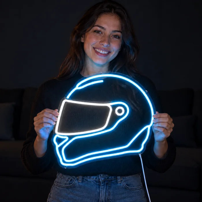 Neon Racing Helmet Neon LED Sign held by a smiling woman against a dark background