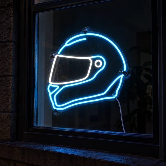 Neon Racing Helmet Neon LED Sign in a window, seen from the street at night