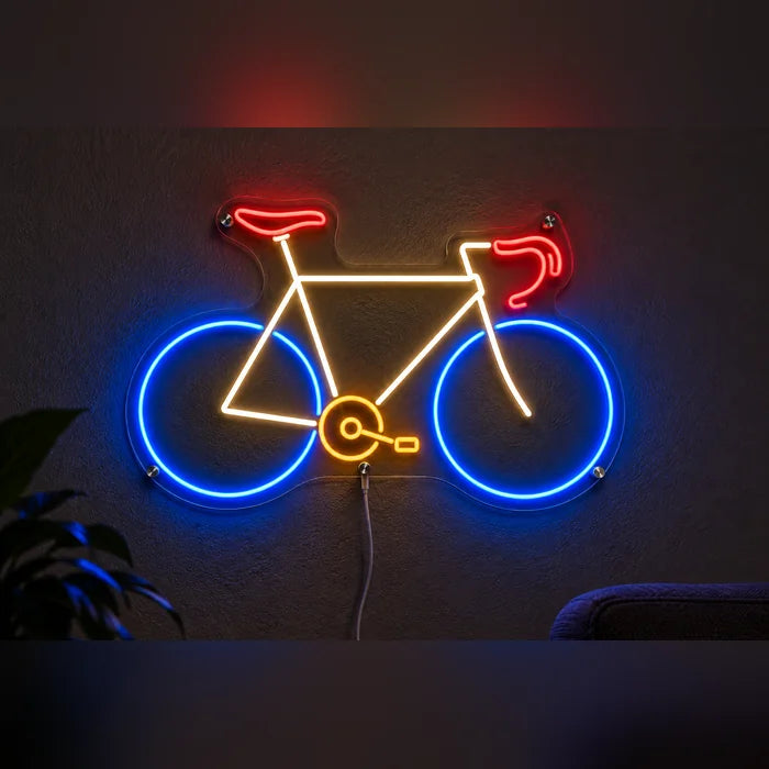 Neon Road Bike Neon LED Sign glowing on a dark wall, close-up with connection cable