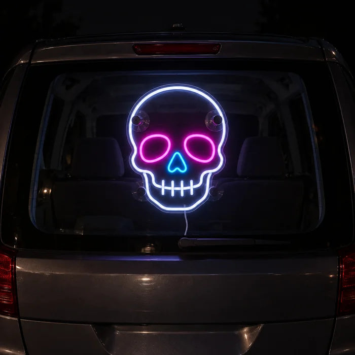 Neon Skull Neon LED Sign on the rear window of a car at night