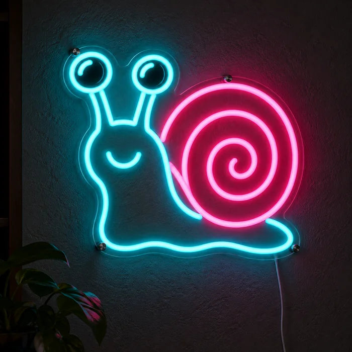Neon Snail Neon LED Sign glowing on a dark wall, close-up with connection cable