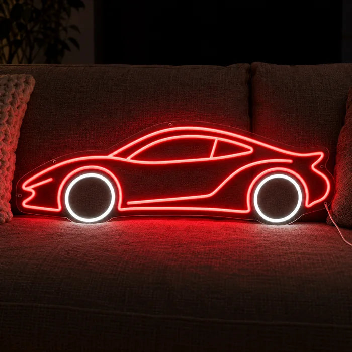 Neon Sports Car Neon LED Sign on a cosy sofa between cushions and a throw