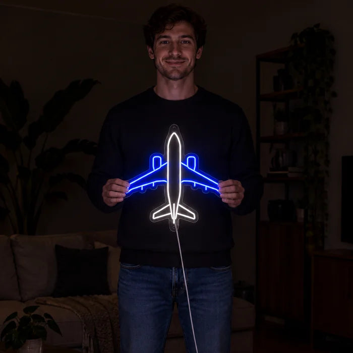 Passenger Plane Neon LED Sign held by a woman, showing its size compared to her body