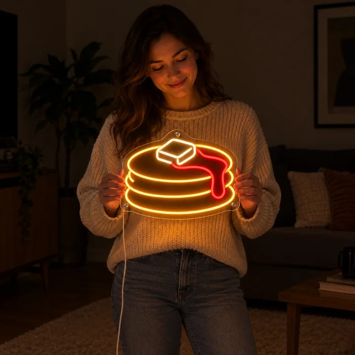 Pancakes Neon LED Sign held by a woman, showing its size compared to her body