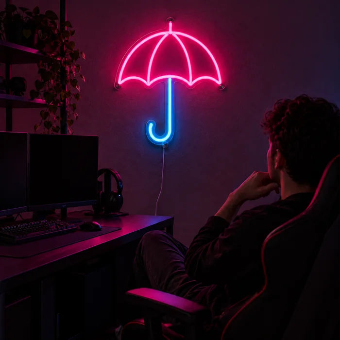 Umbrella Neon LED Sign above a gaming desk, a gamer in a gaming chair in front of it