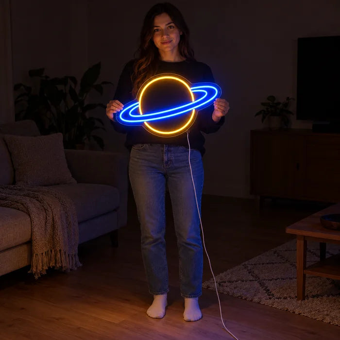 Ringed Planet Neon LED Sign held by a woman, showing its size compared to her body