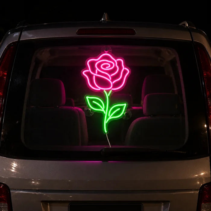 Rose Light Neon LED Sign on the rear window of a car at night
