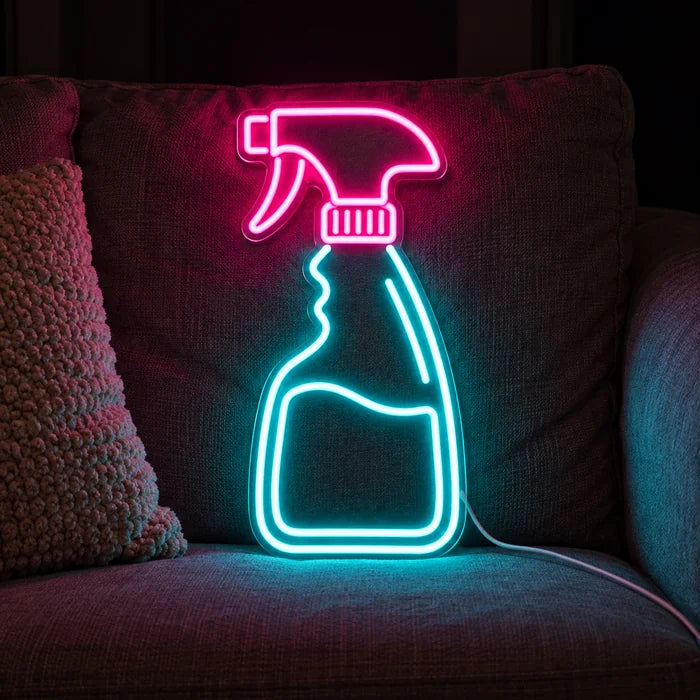 Clean Magic Neon LED Sign on a cosy sofa between cushions and a throw