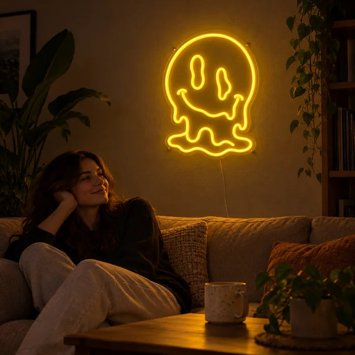 Melting Skull Neon LED Sign on a living room wall, a person relaxing on the sofa in front of it