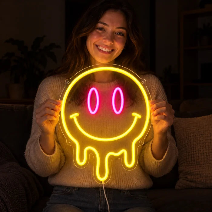 Melting Smiley Neon LED Sign held by a smiling woman against a dark background