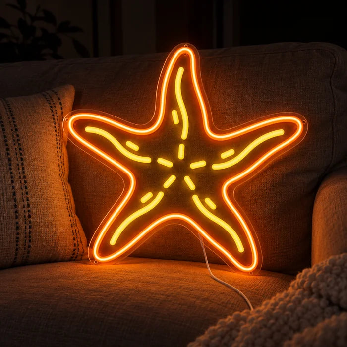 Starfish Neon LED Sign on a cosy sofa between cushions and a throw