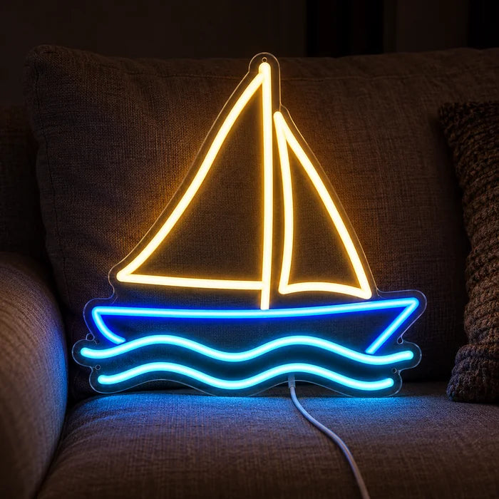 Sailing Boat Neon LED Sign on a cosy sofa between cushions and a throw