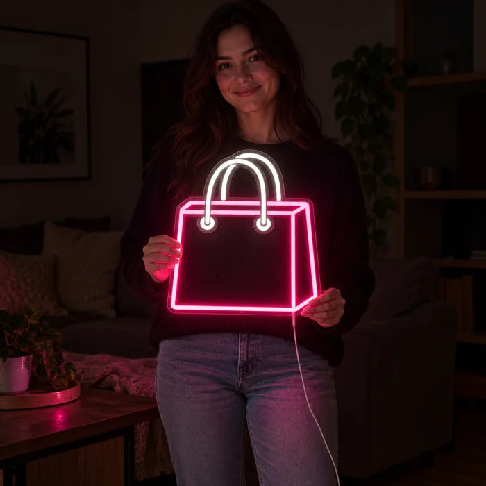 Shopping Bag Neon LED Sign held by a woman, showing its size compared to her body