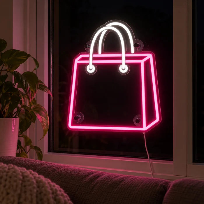 Shopping Bag Neon LED Sign in the window of a cosy living room in the evening