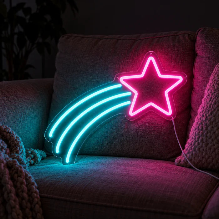 Shooting Star Neon LED Sign on a cosy sofa between cushions and a throw