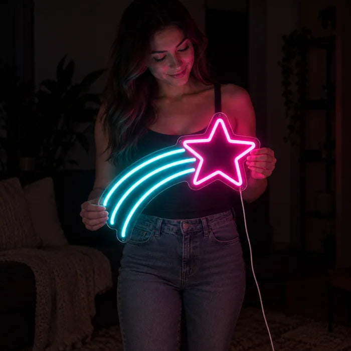 Shooting Star Neon LED Sign held by a woman, showing its size compared to her body