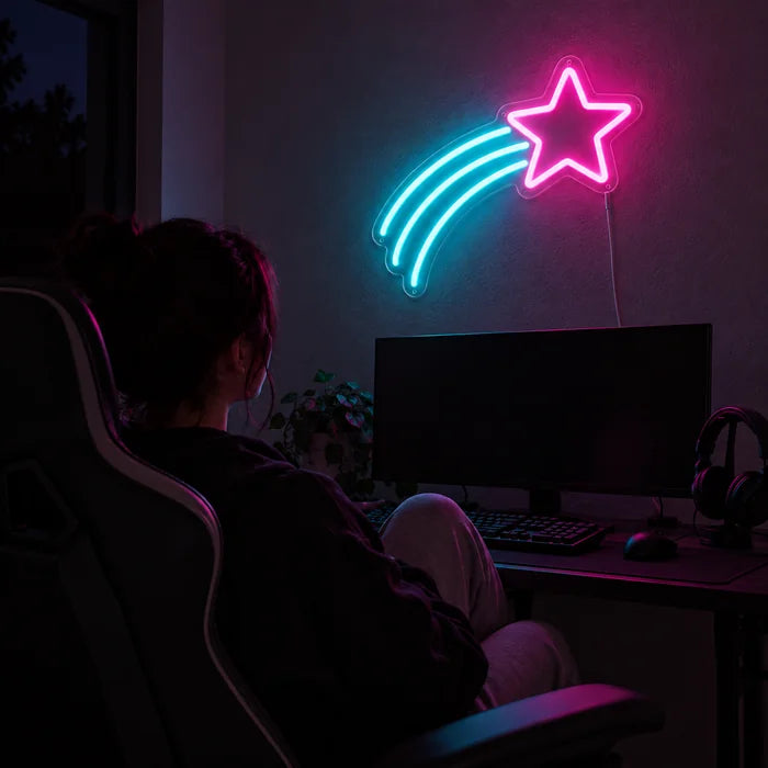 Shooting Star Neon LED Sign above a gaming desk, a gamer in a gaming chair in front of it