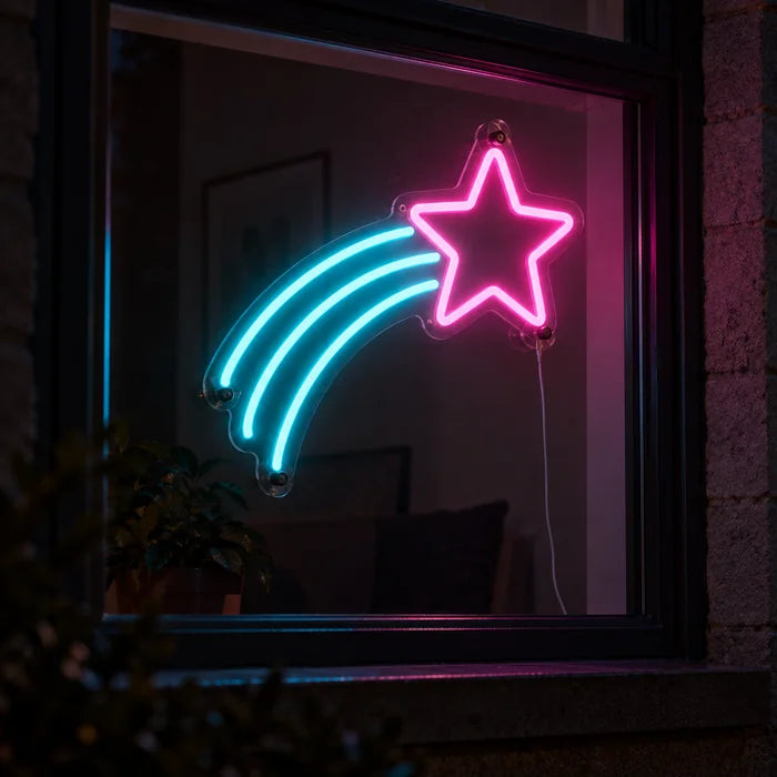 Shooting Star Neon LED Sign in a window, seen from the street at night