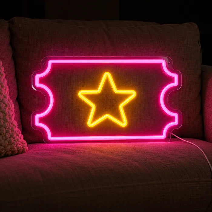 Star Ticket Neon LED Sign on a cosy sofa between cushions and a throw