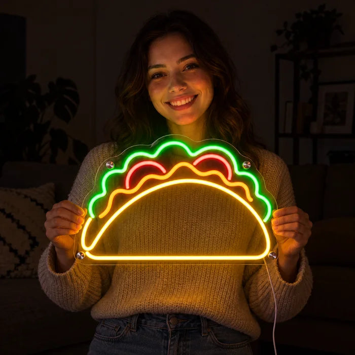 Taco Time Neon LED Sign held by a smiling woman against a dark background