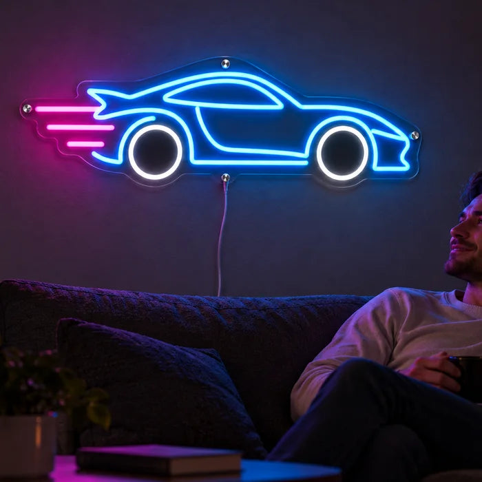 Speed Roadster Neon LED Sign on a living room wall, a person relaxing on the sofa in front of it