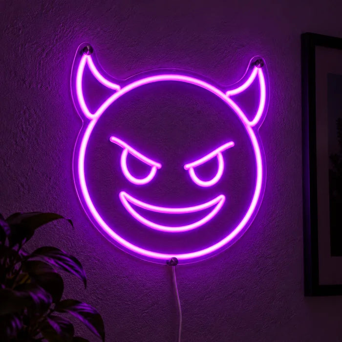 Devil Grin Neon LED Sign glowing on a dark wall, close-up with connection cable