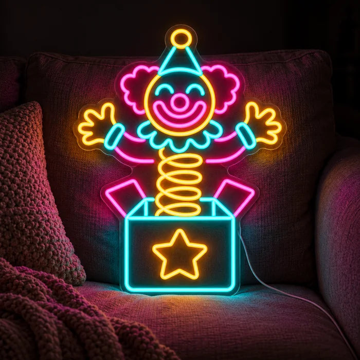 Surprise Clown Neon LED Sign on a cosy sofa between cushions and a throw