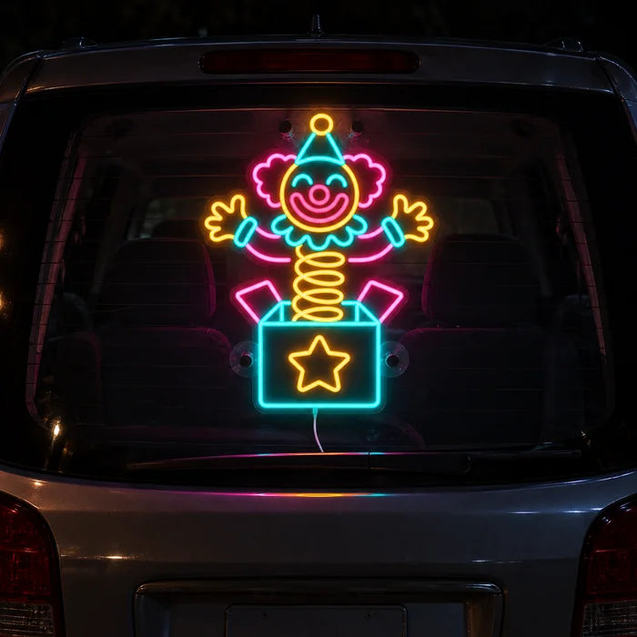 Surprise Clown Neon LED Sign on the rear window of a car at night