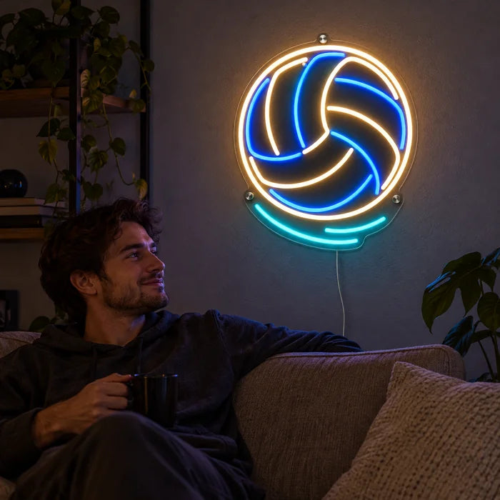 Volleyball Neon LED Sign on a living room wall, a person relaxing on the sofa in front of it