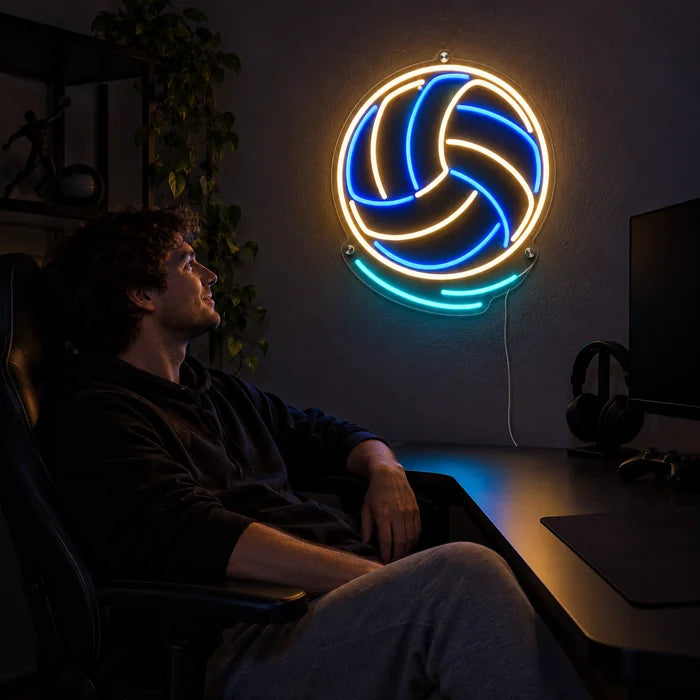 Volleyball Neon LED Sign above a gaming desk, a gamer in a gaming chair in front of it