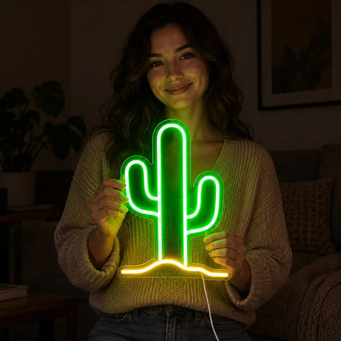Desert Cactus Neon LED Sign held by a smiling woman against a dark background