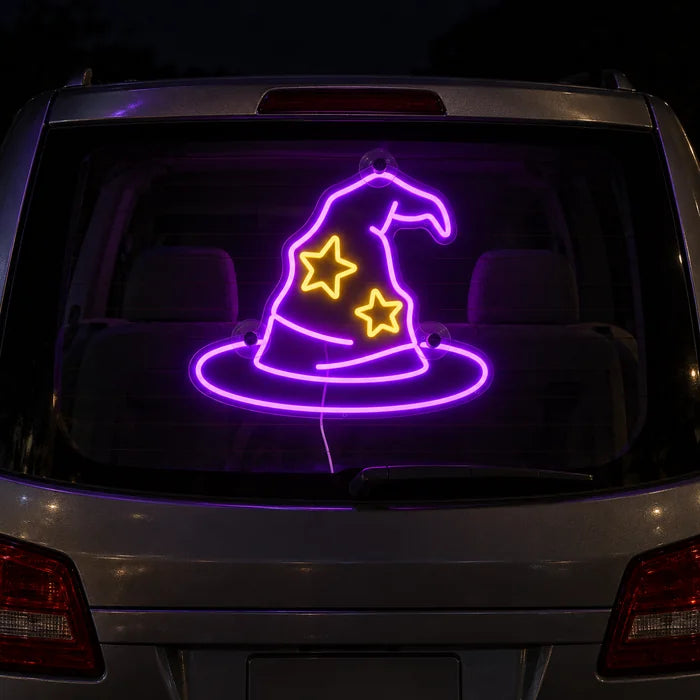 Wizard Hat Neon LED Sign on the rear window of a car at night