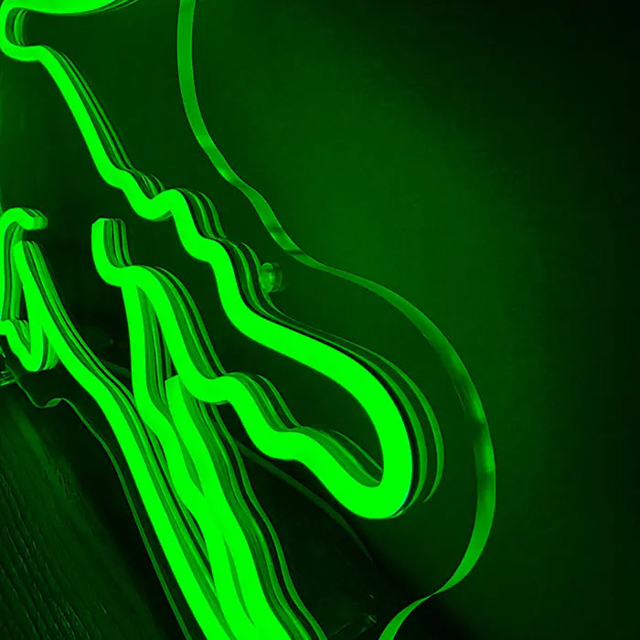 Krokodil Neon LED Schild in Nahaufnahme: grüne LED-Neon-Schläuche auf klarem Acrylglas, deutlich sichtbar