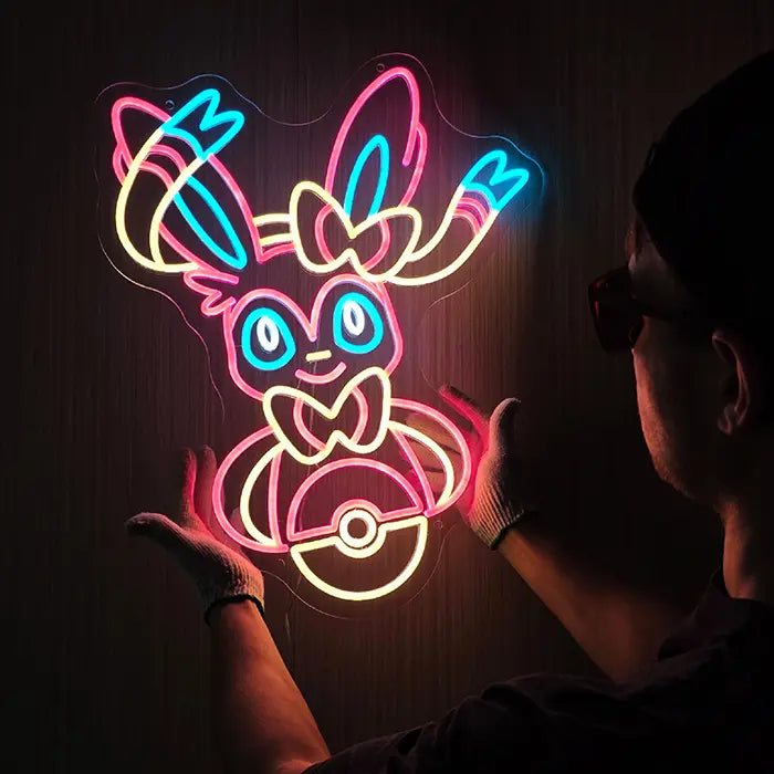 Fantasietier Neon LED Schild wird beim Ausrichten an der Wand gehalten, die Schleifen leuchten hell