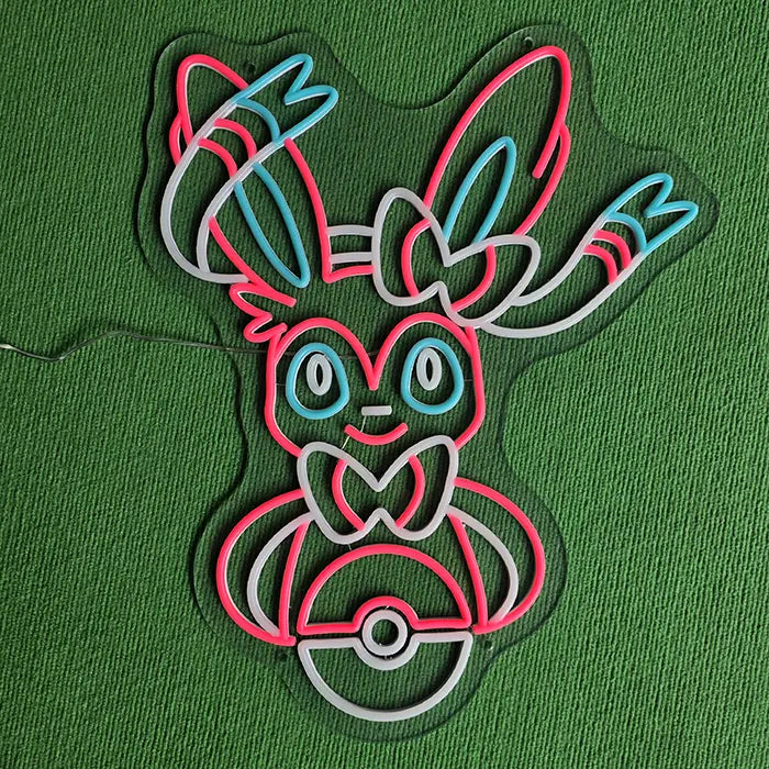 Fantasietier Neon LED Schild ausgeschaltet auf grünem Untergrund, Neonröhren und Bohrlöcher sichtbar