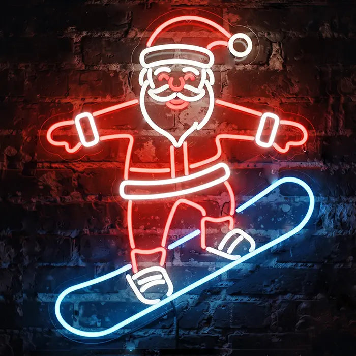 Snowboarding Santa Neon LED Sign front view on a dark brick wall, red suit with white trim and an icy-blue snowboard