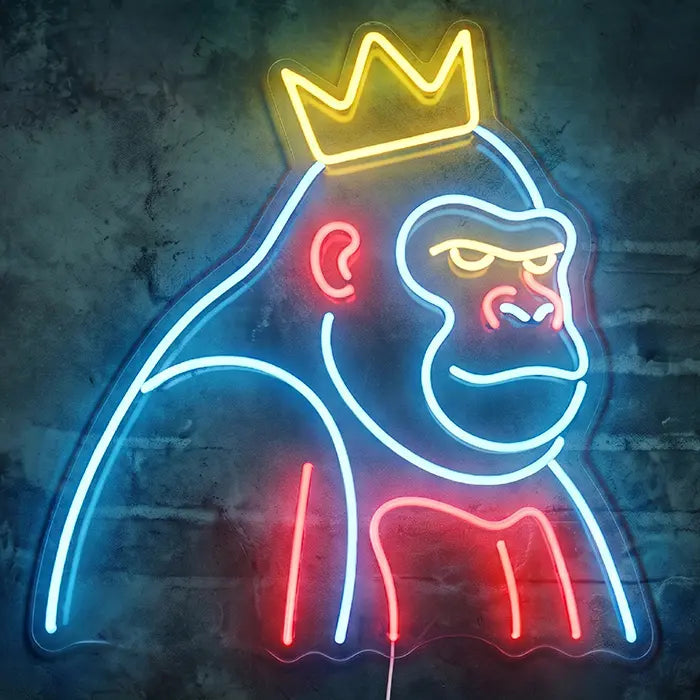 THE BOSS Neon LED Sign head-on against a dark wall: a gorilla in half profile in blue and red with a golden crown
