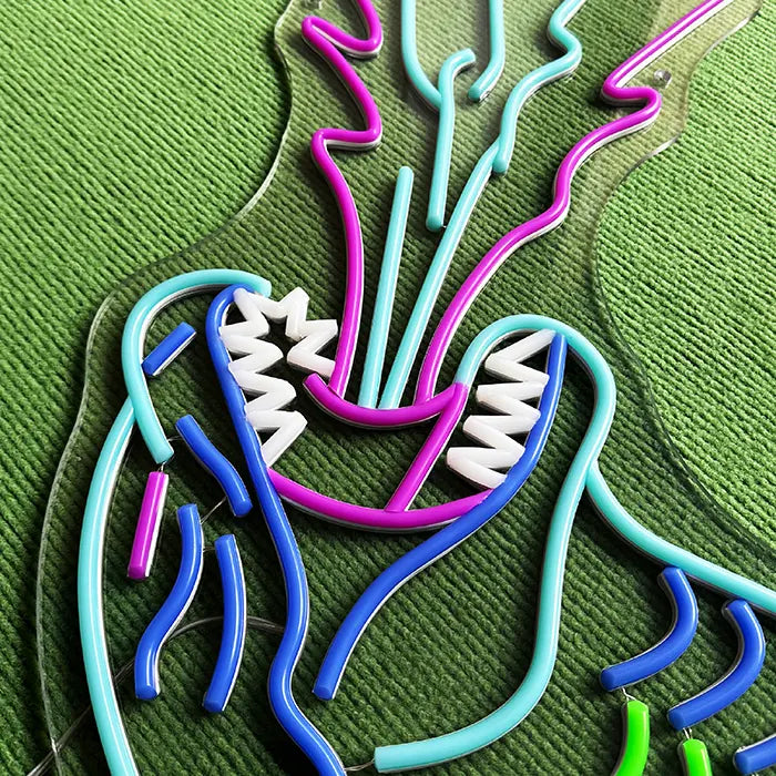 Godzilla Neon LED Sign switched off in macro, teeth and beam made of neon tubing