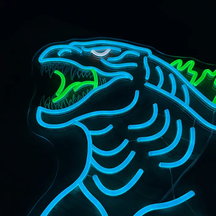 Godzilla Neon LED Sign in close-up, the open mouth with teeth and a green tongue